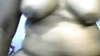 Mature Indian webcam porn model with huge belly spreads her pussy lips